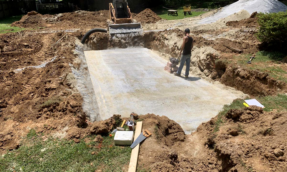 Excavated hole preparation for fiberglass pool installation